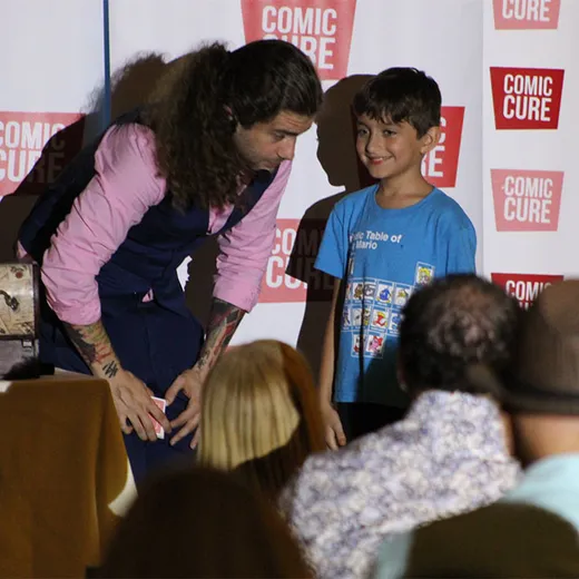 Child at a Comic Cure photo moment